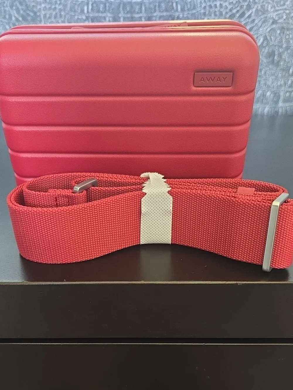 Away Small Hard-Shell Crossbody Case in  Tango Red with Matching Strap